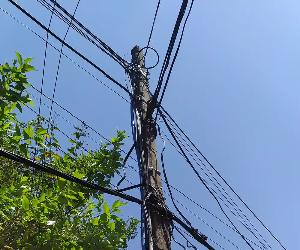 Pole with aerial fiber cables